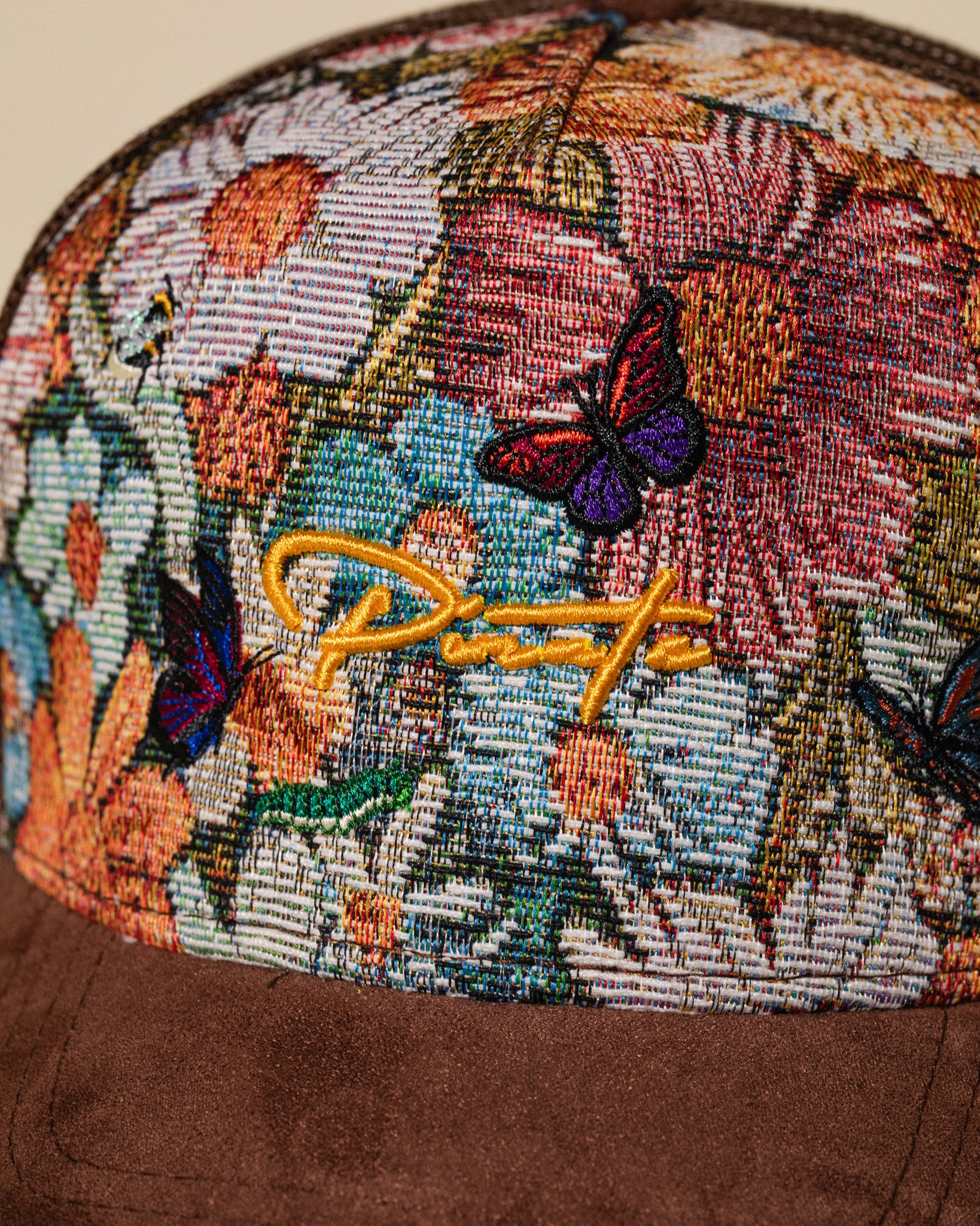 Pirate “Ideas in Transit” Bloom Tapestry Trucker Hat (Brown)