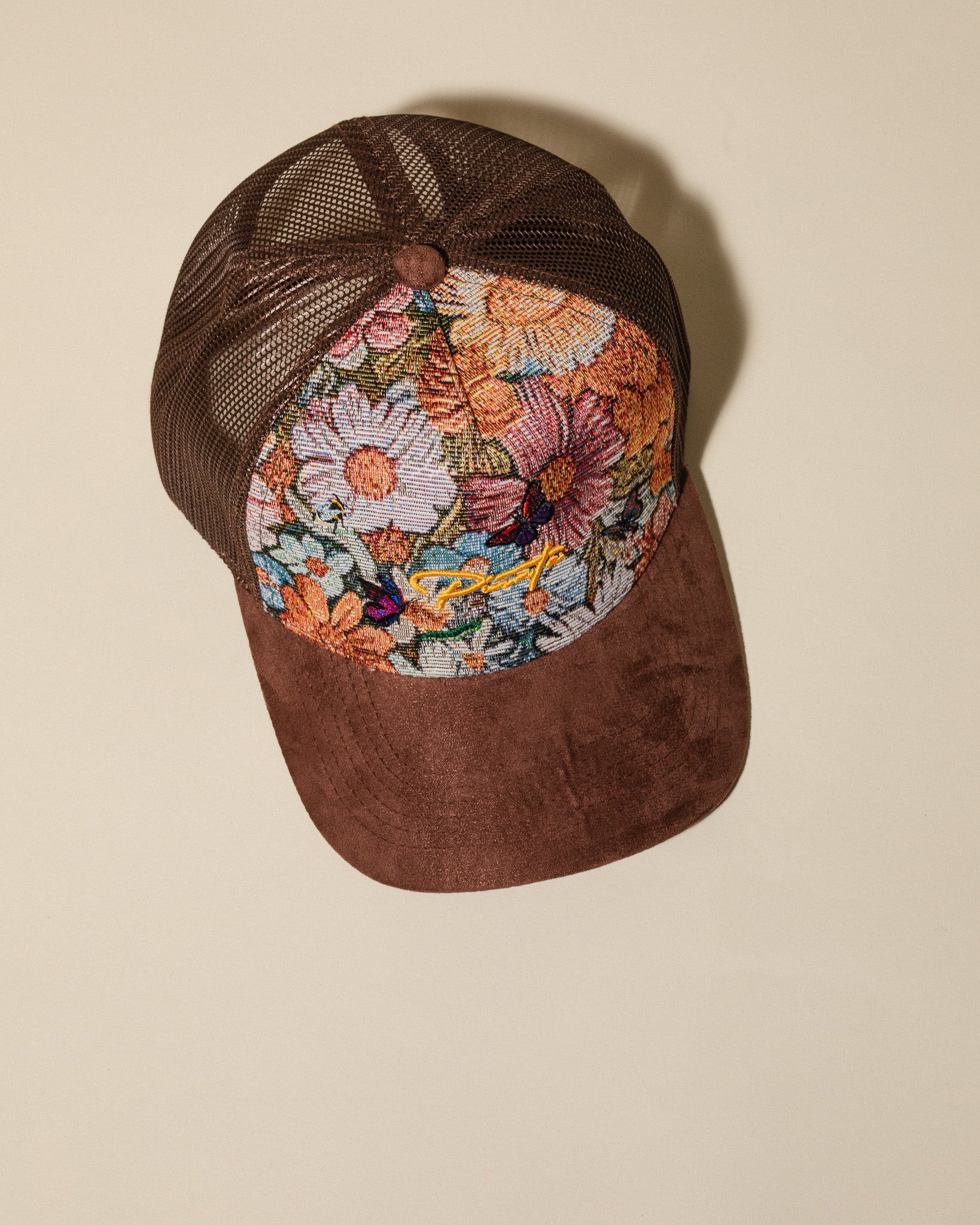 Pirate “Ideas in Transit” Bloom Tapestry Trucker Hat (Brown)
