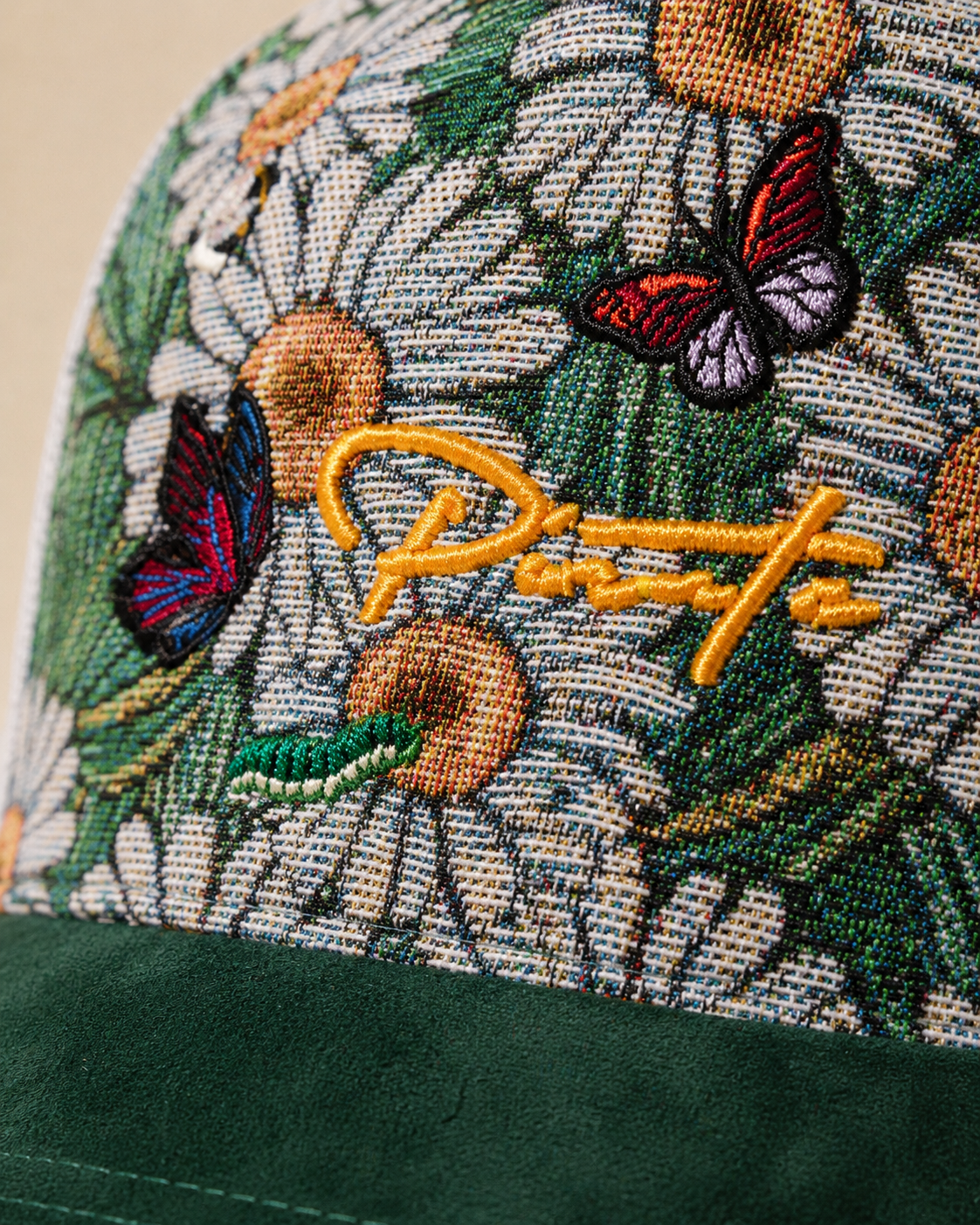 Pirate “Ideas in Transit” Daisy Tapestry Trucker Hat (Forest Green / White)